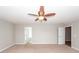 Bedroom showing neutral carpet with fan and access to other rooms at 3529 Galaxy Rd, Ladson, SC 29456