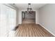 Inviting dining space with laminate floors and views into the living room, creating a seamless flow at 3529 Galaxy Rd, Ladson, SC 29456