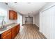 Open concept kitchen leading to the dining area that features wood floors and lots of natural light at 3529 Galaxy Rd, Ladson, SC 29456