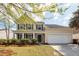 Charming two-story home featuring a well-manicured front yard and an attached two-car garage at 3529 Galaxy Rd, Ladson, SC 29456