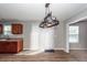 Cozy kitchen nook featuring wood cabinets and a large sliding door with an attached dining area at 3529 Galaxy Rd, Ladson, SC 29456