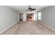 Spacious living room with hardwood floors transitions into the kitchen, providing an open floor plan at 3529 Galaxy Rd, Ladson, SC 29456