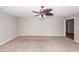Bright living room featuring neutral walls, carpeted floor, and modern ceiling fan at 3529 Galaxy Rd, Ladson, SC 29456