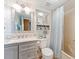 Well-maintained bathroom with a vanity, mirror, shower, and storage cabinets for organization at 3701 Docksite Rd # 108, Edisto Beach, SC 29438