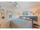 Serene bedroom with natural light, sconce lights, and an adjacent closet or bathroom at 3701 Docksite Rd # 108, Edisto Beach, SC 29438