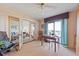 Inviting dining area with large windows offering natural light and great views of the adjacent living area at 3701 Docksite Rd # 108, Edisto Beach, SC 29438
