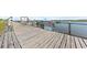 Wooden dock at Edisto Marina, featuring views of the waterfront and docked boats at 3701 Docksite Rd # 108, Edisto Beach, SC 29438