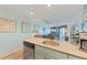 Kitchen island featuring granite countertops and a view into the light blue living area at 3701 Docksite Rd # 108, Edisto Beach, SC 29438