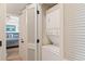 Conveniently located laundry closet, complete with a stacked washer and dryer unit and bi-fold doors at 3701 Docksite Rd # 108, Edisto Beach, SC 29438