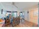 Inviting living room featuring hardwood floors, ceiling fans, comfortable seating, and sliding glass doors to balcony at 3701 Docksite Rd # 108, Edisto Beach, SC 29438