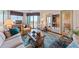 Comfortable living room with an area rug, sliding door access to another room, and a window with a waterfront view at 3701 Docksite Rd # 108, Edisto Beach, SC 29438