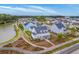 Aerial view showcasing a charming home nestled in a well-planned community near a picturesque lake at 406 Summers Dr, Summerville, SC 29485