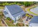 Aerial view of the house with a serene patio space and fire pit with a beautiful, well-kept backyard at 406 Summers Dr, Summerville, SC 29485