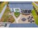 Aerial view of backyard patio with a fire pit and comfortable seating, perfect for outdoor entertaining at 406 Summers Dr, Summerville, SC 29485