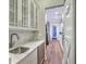 Butler's pantry includes white cabinets, subway tile backsplash, and wine cooler for a chef's delight at 406 Summers Dr, Summerville, SC 29485