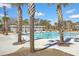 Beautiful pool area with palm trees, lounge chairs and umbrellas, perfect for community enjoyment at 406 Summers Dr, Summerville, SC 29485