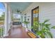 Charming front porch features a porch swing, ceiling fan, and views of the pond, perfect for relaxing outside at 406 Summers Dr, Summerville, SC 29485