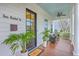 Inviting front porch with a ceiling fan, potted plants, and comfortable seating, perfect for relaxation at 406 Summers Dr, Summerville, SC 29485