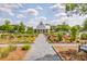 Quaint home with a charming garden path leading to the entrance, showcasing beautiful landscaping at 406 Summers Dr, Summerville, SC 29485