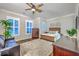 Serene main bedroom boasting hardwood floors, natural light, and elegant furnishings at 406 Summers Dr, Summerville, SC 29485