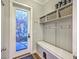 Mudroom featuring a bench with storage, hooks, and cubbies by the front door at 406 Summers Dr, Summerville, SC 29485