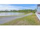 Scenic view of a peaceful pond with a walking path, surrounded by lush greenery at 406 Summers Dr, Summerville, SC 29485