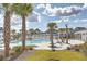 Community pool area features palm trees, lounge chairs, and a sparkling pool for residents to enjoy on sunny days at 406 Summers Dr, Summerville, SC 29485