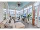 Bright sunroom featuring ample natural light, lake views, and modern exercise equipment at 406 Summers Dr, Summerville, SC 29485