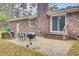 Brick house featuring an outdoor area perfect for grilling and dining with a grill and table set at 407 Boone Hill Rd, Summerville, SC 29483