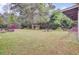 Expansive backyard with lawn, play structure, gazebo, and mature trees at 407 Boone Hill Rd, Summerville, SC 29483