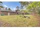 Large grassy backyard featuring play structure, mature trees and a gazebo at 407 Boone Hill Rd, Summerville, SC 29483
