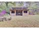Backyard shed with a rustic design and a partially covered seating area, ideal for outdoor activities at 407 Boone Hill Rd, Summerville, SC 29483
