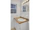 Inviting bathroom with a classic vanity, mirror, ample light, and modern fixtures for a relaxing experience at 407 Boone Hill Rd, Summerville, SC 29483