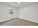 Cozy bedroom with neutral carpet and a window offers a comfortable and peaceful living space at 407 Boone Hill Rd, Summerville, SC 29483