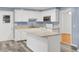 Modern kitchen with white cabinets, center island and stainless steel microwave at 407 Boone Hill Rd, Summerville, SC 29483