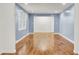 Open living room with blue walls and hardwood floors at 407 Boone Hill Rd, Summerville, SC 29483