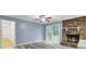 Inviting living room with brick fireplace and sliding door to the outdoors at 407 Boone Hill Rd, Summerville, SC 29483