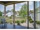 View from the back porch featuring an outdoor chair and a glimpse of a neighborhood at 4303 Misty Hollow Ln, Ravenel, SC 29470