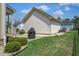 Well-manicured backyard with a patio, grill, and lush landscaping for outdoor enjoyment at 4303 Misty Hollow Ln, Ravenel, SC 29470