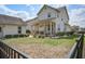 Beautiful backyard featuring lush lawn, well-maintained landscaping, and a cozy porch area perfect for outdoor relaxation at 4303 Misty Hollow Ln, Ravenel, SC 29470