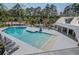 Inviting community pool area with ample lounge chairs, perfect for relaxation and recreation in a resort-style setting at 4303 Misty Hollow Ln, Ravenel, SC 29470