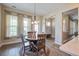 Bright dining room featuring wood table and natural light at 4303 Misty Hollow Ln, Ravenel, SC 29470