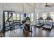 Well-equipped gym featuring modern exercise equipment and ample natural light, perfect for maintaining an active lifestyle at 4303 Misty Hollow Ln, Ravenel, SC 29470