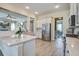 Spacious kitchen with island, stainless steel fridge, and open layout at 4303 Misty Hollow Ln, Ravenel, SC 29470