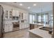 Bright, modern kitchen with stainless steel appliances and white cabinetry at 4303 Misty Hollow Ln, Ravenel, SC 29470