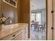 Butler's pantry with white cabinets and view of the dining room at 4303 Misty Hollow Ln, Ravenel, SC 29470