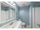 Bathroom featuring a blue wall, a toilet, a shower and vanity mirror at 507 Stinson Dr # 3A, Charleston, SC 29407