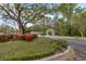 Entrance to the community with manicured shrubs, trees and a gazebo at 507 Stinson Dr # 3A, Charleston, SC 29407