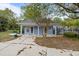 Charming light blue exterior with a well-manicured lawn, adjacent to a refreshing pool area, perfect for outdoor relaxation at 507 Stinson Dr # 3A, Charleston, SC 29407