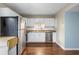 Modern kitchen features stainless steel appliances, white cabinetry, and granite countertops at 507 Stinson Dr # 3A, Charleston, SC 29407
